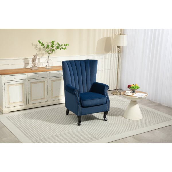 Öronlappsfåtölj i blått sammet Öronlappsfåtölj i blått sammet