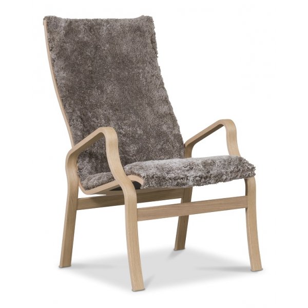 Svea fauteuil met voetenbank - bruine schapenvacht / geolied eikenhout