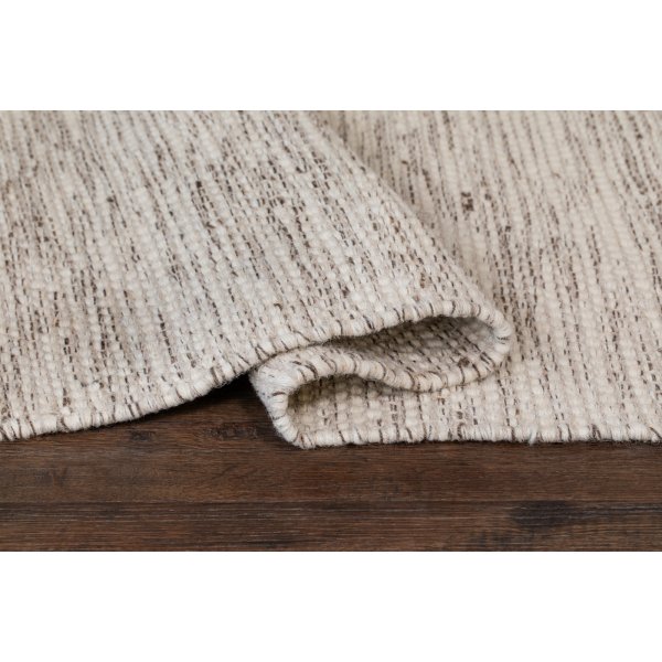 Tapis tuft en laine tiss main Crme